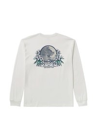 Long-sleeve white t-shirt featuring a circular blue graphic of a surfer surrounded by floral and leaf designs with text below.