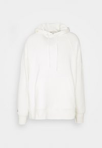 Bílá mikina s kapucí vyrobená z měkké látky, s přední kapsou, šňůrkou na kapuci a žebrovanými manžetami. Má uvolněný střih a výšivku na švech.