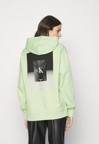 Calvin Klein Jeans OVERSIZED HOODIE - Felpa con cappuccio - exotic mint