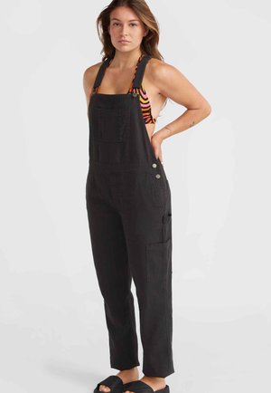 Zwarte jumpsuit gemaakt van duurzaam stof, met brede banden, een voorzak en zijzakken, met een rechtse pijpenontwerp.