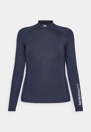 Marineblaues langärmeliges Sportoberteil mit hohem Kragen, figurbetontem Design und weißem Logo auf dem Ärmel. Hergestellt aus glattem, dehnbarem Stoff.