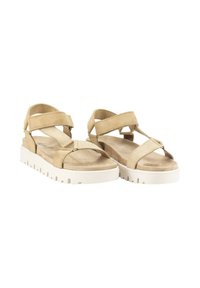 Sandalias beige con dos cintas de velcro anchas, una superficie texturizada y una suela blanca gruesa con un patrón acanalado para mayor agarre.