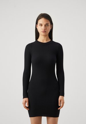 Black ribbed long-sleeve dress with a fitted silhouette, featuring a round neck and smooth texture, reaching mid-thigh length.
