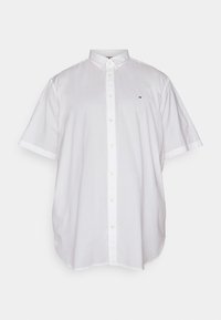 Camicia bianca a maniche corte con colletto button-down e un piccolo logo ricamato sul lato sinistro del petto.