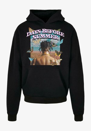 Mustmust must-hall, mille nudivis nussidivis, pühendatud pealkirjaga "PÄEVAD ENNE SUVE" roosas.