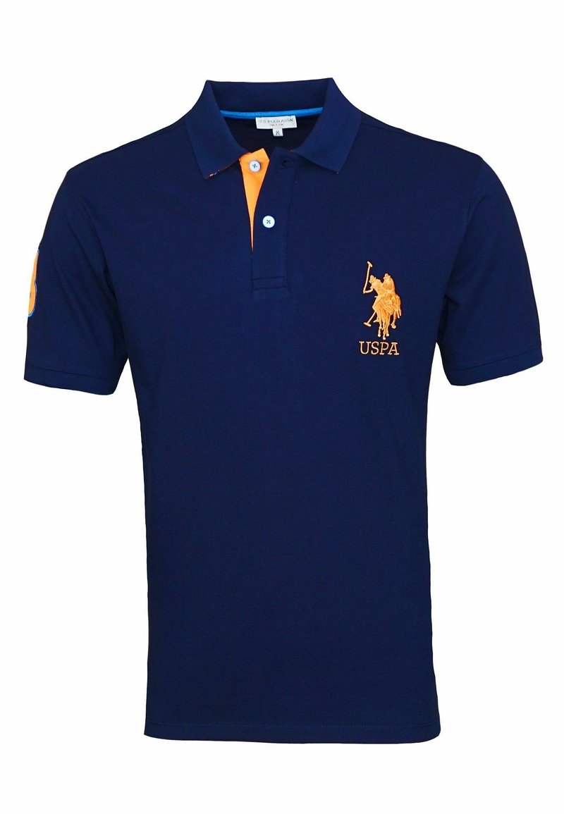 Navy blue short-sleeve polo shirt with orange accents featuring a polo player logo and USPA text on the chest.