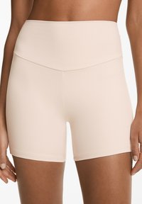 Ljusrosa högmidjade shorts gjorda av ett mjukt, elastiskt material. Har en figurnära design och en ren, sömlös midja för komfort.