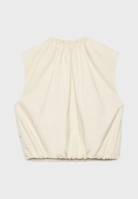 Blouse sans manches couleur crème avec encolure et bas élastiqués froncés, vue de dos sur un fond clair uni.