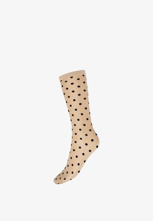 Chaussette beige mi-mollet avec de petits motifs floraux noirs uniformément répartis sur le tissu, présentée sur un fond blanc.