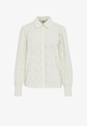 Lace blouse in cream, featuring a collared neckline, button closure, long puff sleeves, and a floral patterned design throughout.