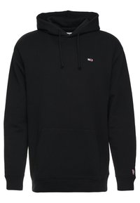 Sudadera negra con capucha y bolsillo canguro frontal, capucha con cordón y pequeños logotipos de Tommy Hilfiger en el pecho y el puño de la manga.