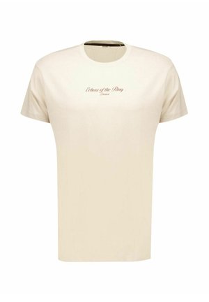 T-shirt beige à manches courtes avec col rond et texte marron "Echoes of the Ring Deluxe" centré sur la poitrine.