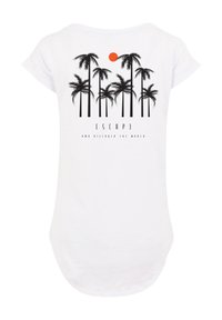White t-shirt featuring a black palm tree graphic, a red sun, and the text "ESCAPE AND DISCOVER THE WORLD" below the design. Short sleeves.
