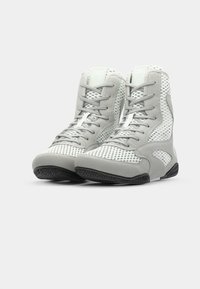 Gray athletic boots with a mix of smooth and textured materials, featuring mesh sections, lace-up design, and a black rubber sole.