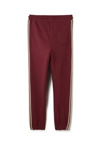 Pantalones jogger burdeos con cintura elástica, franjas laterales en color crema y un único bolsillo trasero. Puños ajustados en los tobillos. Material de algodón suave.