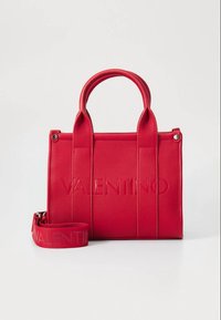 Red textured handbag with two handles and embossed "VALENTINO" logo. Includes a matching shoulder strap. Rectangular shape with structured design.