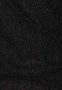Black lace fabric with a floral pattern, featuring a textured surface and intertwining designs, creating a layered effect.