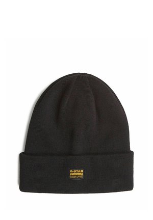 Czarna dzianinowa czapka z podwiniętym mankietem i małą żółtą naszywką z logo G-Star Originals Raw Denim z przodu.
