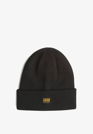 Bonnet noir tricoté avec revers plié et petit patch logo jaune G-Star Originals Raw Denim à l'avant.