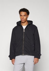 Lacoste Jachetă subțire - black