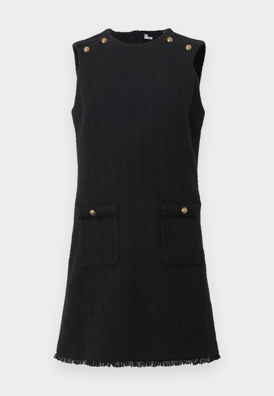 Fekete ujj nélküli ruha texturált anyagból, két elülső zsebbel, arany gomb díszítéssel és bojtós szegéllyel.