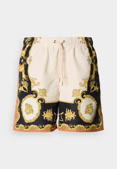 Μαγιό βερμούδα σε κρεμ και μαύρο με χρυσό μπαρόκ σχέδιο. Διαθέτει ελαστική μέση με κορδόνι και αντίθετες τυπωμένες λεπτομέρειες.