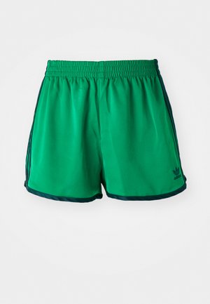 Zöld sportnadrág sima textúrával, rugalmas derékkal és sötétzöld oldalsó akcentussal. Az alsó szegélyen az Adidas logó található.