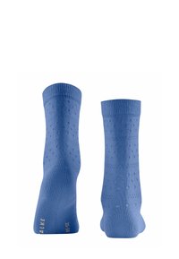 Calze di cotone blu con polsini a coste, una texture liscia e piccoli motivi a pois su tutta la superficie, con accenti dorati alla base.