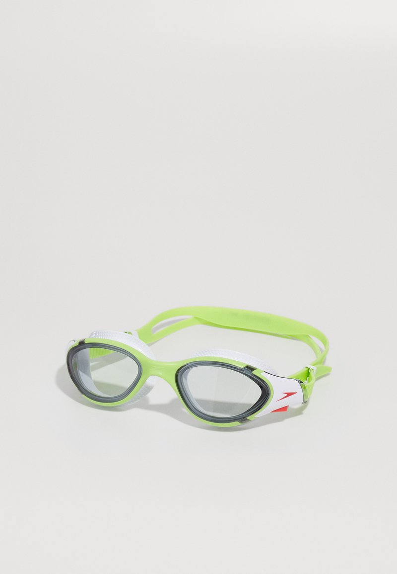 Duikbril met een felgroen flexibele frame, witte silicone accenten en getinte grijze lenzen. Heeft een verstelbare band voor een veilige pasvorm.