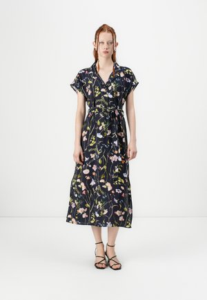 Floral print midi dress in dark navy fabric, short sleeves, collared neckline, cinched waist with matching belt, and side slits.