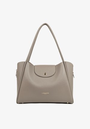 Taupe leather Lancaster Paris handbag with top flap, gold button closure, long handles, and subtle texture.