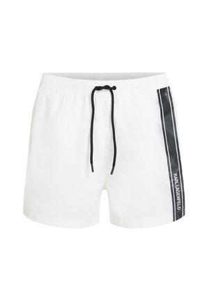 Bela kopalna kratka hlača z črnim vrvico, z stranskim dizajnom v črni barvi z belimi črtami in besedilom "KARL LAGERFELD".