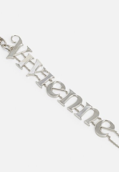 Silver chain bracelet featuring interlinked letters spelling "Vivienne." Smooth surface with a polished finish and varied font styles.