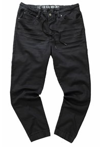 Schwarze Jogginghosen mit einem Kordelzugbund, elastischen Bündchen, Fronttaschen und strukturierten Streifen entlang der Oberschenkel. Glatte Stoffoberfläche.