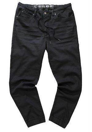 Zwarte joggingsbroek met een trekkoord in de taille, elastische boorden, zijzakken en gemeleerde strepen langs de bovenbenen. Glad stofoppervlak.