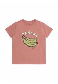 Rožinė medvilninė marškinė, ant kurių pavaizduoti du bananai ir žodis "BANANA" viršuje, su kursive parašu apačioje dešinėje.