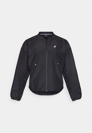 Black lightweight jacket with a zip front, round neck, long sleeves, and subtle texture. Features side pockets and a logo on the chest.