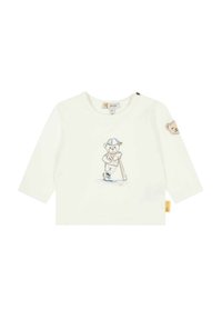Witte lange mouwen shirt met een berenafbeelding die een knuppel vasthoudt en een pet draagt. Inclusief drukknoopsluiting op de schouder en accentdetails.