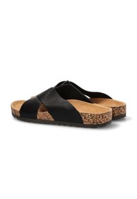 Sandalias deslizantes de cuero negro con suela de corcho, que presentan correas cruzadas y una plantilla texturizada para mayor comodidad. Diseño plano y minimalista en general.