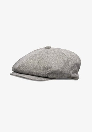 Grey herringbone-patterned flat cap, made from textured fabric with a rounded crown and curved brim, featuring a central top button.