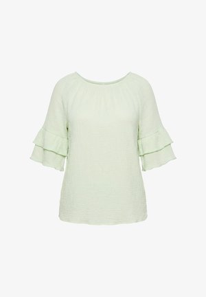 Blusa verde claro texturizada con escote redondo y mangas tres cuartos con volantes en capas.