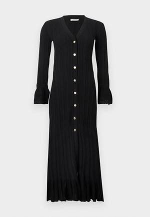 Robe midi noire côtelée à manches longues avec décolleté en V, boutons dorés sur le devant, poignets évasés et ourlet volanté.