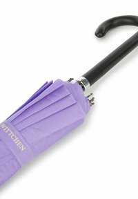 Purple pleated umbrella with a black curved handle, silver metal details, and a branded label on the canopy.