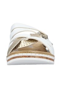 White slide sandal with wide straps, featuring a gold accent and perforated detail. Cork textured footbed and white rubber sole.