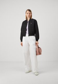 Calvin Klein Jeans QUILTED - Overgangsjakke - black