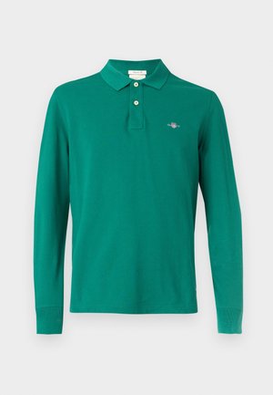 Maglia polo verde a maniche lunghe in cotone. Presenta un colletto, una patta con due bottoni e un logo ricamato sul petto.