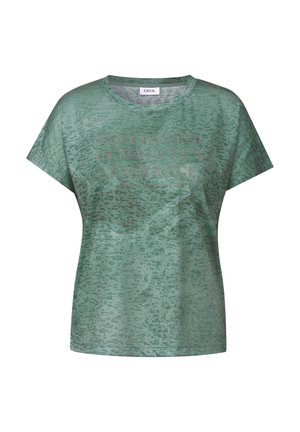 Zelené grafické tričko s krátkým rukávem, které má texturovaný, abstraktní vzor. Text na přední straně je zdoben malými kamínky.