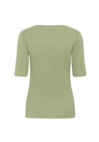 Haut ajusté à manches courtes en coton doux de couleur vert clair, avec un col rond et une texture lisse sans embellissements visibles.