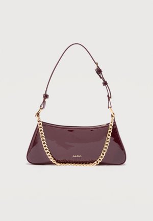 Tume burgundia läikiv nahast käekott reguleeritava rihma ja kuldse kett_detailiga, esiküljel väike kuldne ALDO logo.