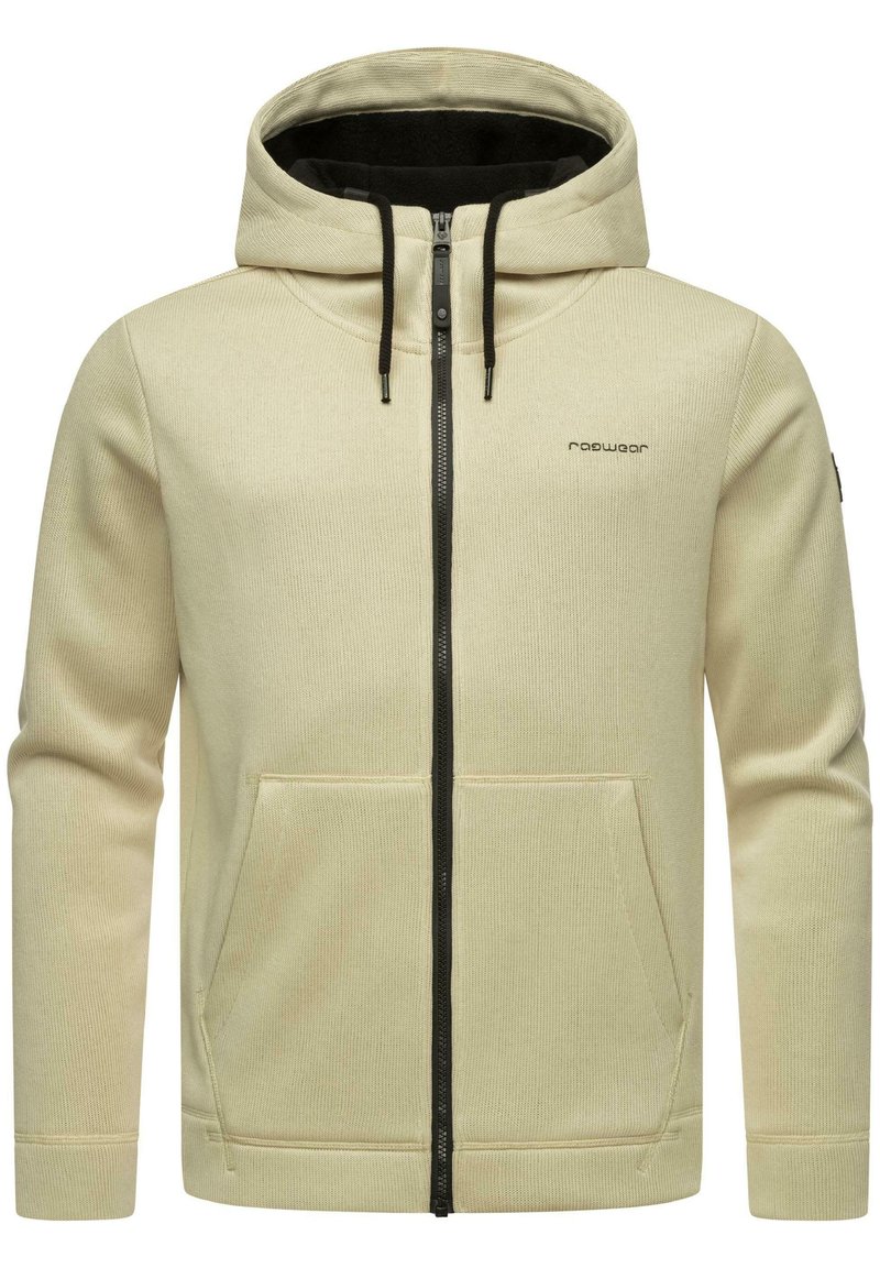 Felpa con zip color crema, con zip nera, tasche frontali, tessuto spesso, cappuccio con stringa e logo discreto sul lato sinistro del petto.
